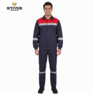 Man modeling a navy blue safety jumpsuit with a red chest panel and reflective stripes on the sleeves and legs, Staris Workwear logo visible in the top left.