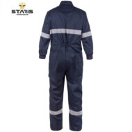 Back view of navy work coverall with light-reflective stripes around the upper arms and lower legs, Staris Workwear logo visible at top left.