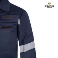 Navy work jacket with two Velcro patches and a reflective stripe on the sleeve, Staris Workwear logo in the corner.