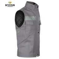 Gray sleeveless work vest with reflective strip and multiple pockets, brand Staris Workwear visible at top left. The inner quilted black lining is exposed at the armhole.