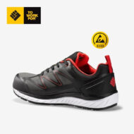 Black and red athletic shoe with white sole, safety/ESD symbol nearby indicating electrical ground protection