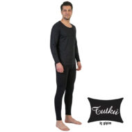 Man wearing a black thermal underwear set (long-sleeve top and leggings), standing barefoot; Touhku iç giyim logo in bottom right.