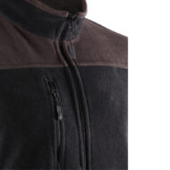 Close-up of a two-tone fleece jacket (brown upper band, black lower) with a front full-zip and a smaller zippered chest pocket.