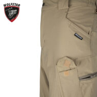Beige cargo pants close-up showing side pocket, Velcro tabs, and Wolfstar brand tag