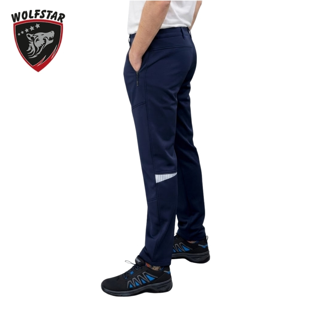 Navy scrub pants with zip pockets and a reflective stripe on the lower leg, paired with sneakers.