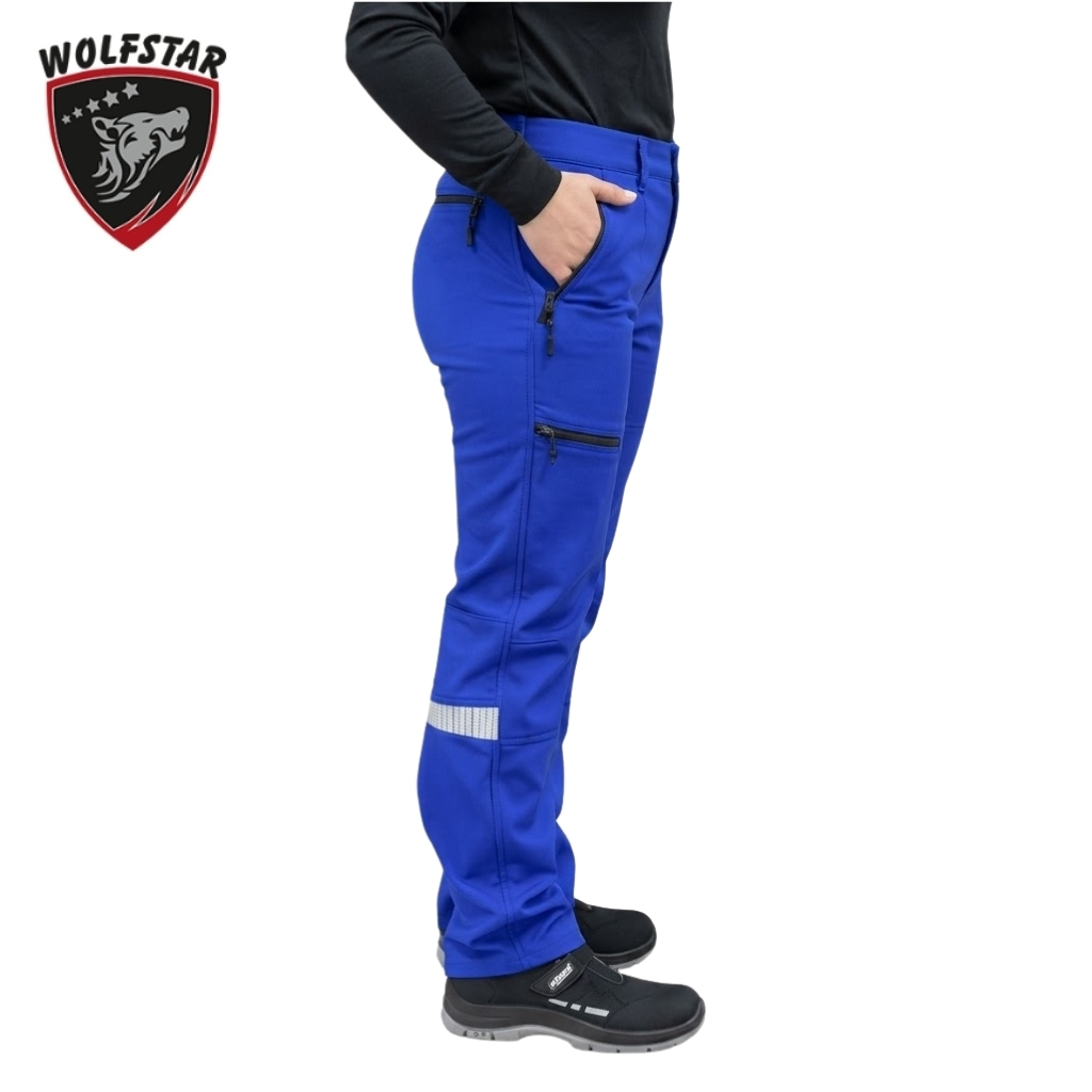 Side view of a person wearing bright blue outdoor pants with zippered pockets and a reflective strip on the lower leg, paired with black shoes.